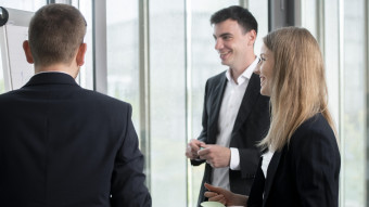 Three people talking